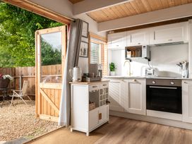 A kitchen with a door leading outside at Hazel in Blandford Forum
