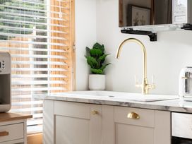 A kitchen with a sink and faucet at Hazel in Blandford Forum