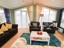 A snug with seating and a coffee table at Rosie's Zen Den in High Hesket near Armathwaite