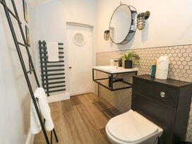 A bathroom with a sink and toilet at The Old Post Office in Weymouth