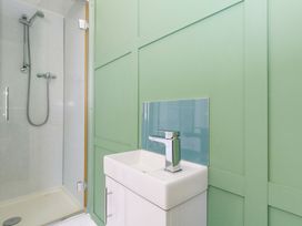 A bathroom featuring a shower and a sink at The Old Post Office in Weymouth