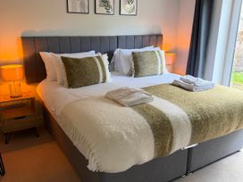A bedroom with a bed and bedside table at The Annexe Bridlington