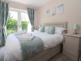 A bedroom with a double bed and bedside tables at Church View in Withernwick near Aldbrough
