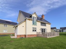 A house with a deck and large windows at The Beach House (Beadnell) Beadnell