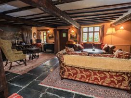 A living room with a sofa and coffee table at Hart Head Farm in Rydal near Ambleside