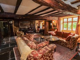 A living room with sofas and a coffee table at Hart Head Farm in Rydal near Ambleside