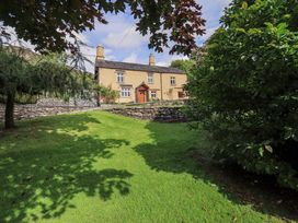 A house with a garden and stone wall at Hart Head Farm Rydal near Ambleside