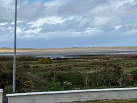 A view of water and landscape from a location at Geesala