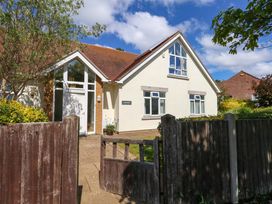 A house with a gate and a pathway at 1 Fernhill Avenue Weymouth