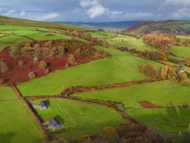 An aerial view of fields and houses at Ystrad Wen in Llysdinam near Newbridge-On-Wye