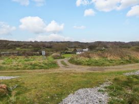 An outdoor landscape with a path and greenery at Belan Wen in Llanddona near Pentraeth