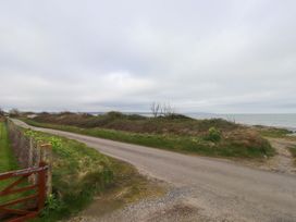 A road alongside the ocean at Belan Wen in Llanddona near Pentraeth