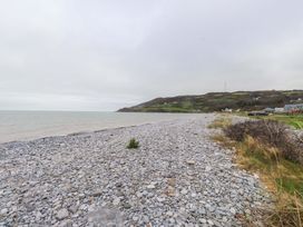 A beach with pebbles and sea at Belan Wen in Llanddona near Pentraeth