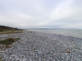 A rocky shoreline with water at Belan Wen in Llanddona near Pentraeth