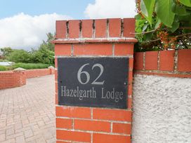 A house sign with the number 62 at Hazelgarth Lodge in Hunmanby
