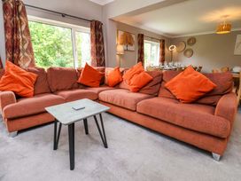 A living room with a sofa and coffee table at Hazelgarth House in Hunmanby