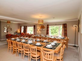 A dining room with a large table and chairs at Hazelgarth House Hunmanby