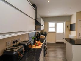 A kitchen equipped with appliances and food preparation items at Hazelgarth House in Hunmanby
