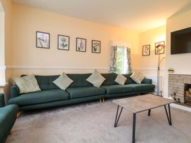 A living room with a sofa and coffee table at Hazelgarth House in Hunmanby
