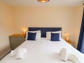 A bedroom with a double bed and side tables at Hazelgarth House in Hunmanby