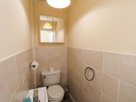 A bathroom with a toilet and sink at Hazelgarth House in Hunmanby