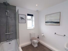 A bathroom with shower and bathtub at Hazelgarth House in Hunmanby