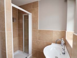 A bathroom with a shower and a sink at Hazelgarth House in Hunmanby