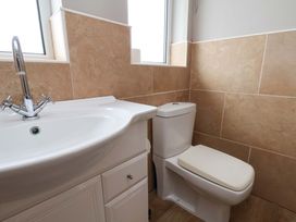 A bathroom with a sink and toilet at Hazelgarth House Hunmanby