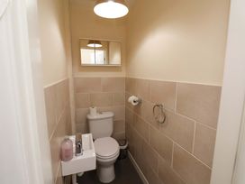 A bathroom with a toilet and sink at Hazelgarth House in Hunmanby