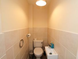 A bathroom with a toilet and sink at Hazelgarth House in Hunmanby