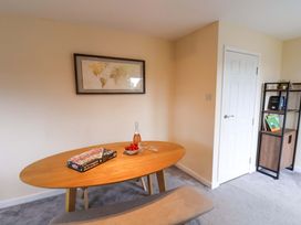 A dining room with a table and strawberries at Hazelgarth House in Hunmanby