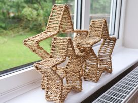 Woven star decorations on a window sill at Hazelgarth House in Hunmanby