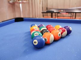 A collection of pool balls on a pool table at Hazelgarth House in Hunmanby