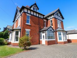 A house with a driveway and garden at Fern Lee in Carlisle