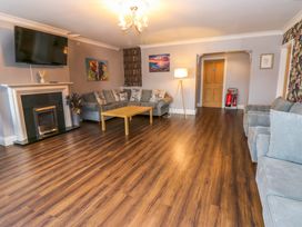 A living room with a sofa and coffee table at Fern Lee in Carlisle