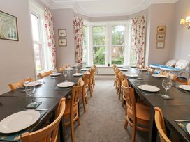 A dining room with tables and chairs at Fern Lee in Carlisle