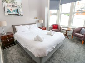 A bedroom with a bed and furniture at Fern Lee Carlisle