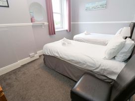 A bedroom with twin beds and a window at Fern Lee in Carlisle