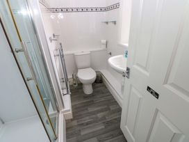 A bathroom with a shower, toilet, and sink at Fern Lee in Carlisle