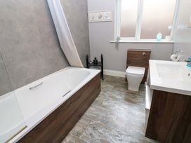 A bathroom with a bathtub, toilet, and sink at Fern Lee, Carlisle