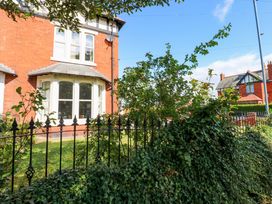 A house with windows and fence in the garden at Fern Lee in Carlisle