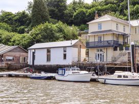A view of houses and boats on the water at Dolphin Cottage Brixham