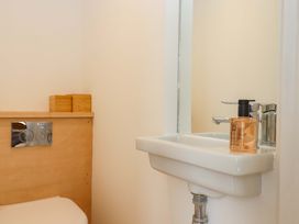 A bathroom with a toilet and sink at Dolphin Cottage in Brixham