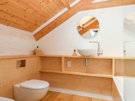 A bathroom with a toilet and sink at Dolphin Cottage in Brixham