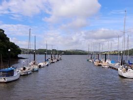 A view of boats docked on water at Dolphin Cottage in Brixham