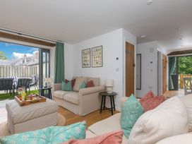 A living room with a sofa and coffee table at Carines Barns - Pen, Cubert