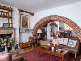 A living room with a sofa and coffee table at Lower Mill in Dittisham