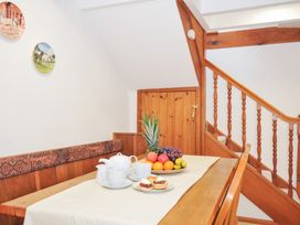 A dining room with fruit and tea set on a table at Henwood Barn Henwood near Upton Cross