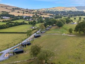 An aerial view of fields and buildings at Fawn’s Rest Nantmel near Rhayader
