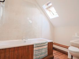 A bathroom with bathtub and toilet at 10 The Gardens Rousdon near Lyme Regis